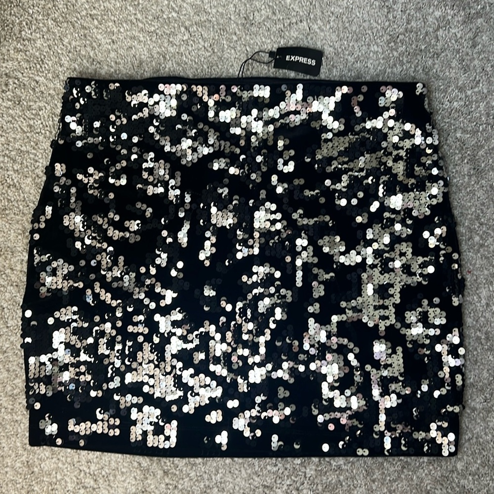 Fully lined Express sequins skirt.